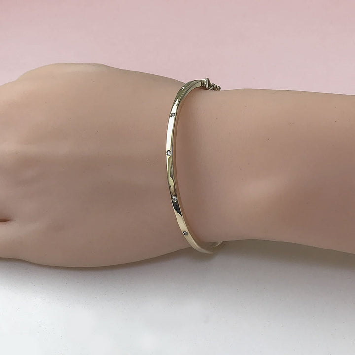 9ct Gold Hinged Oval Diamond Bangle