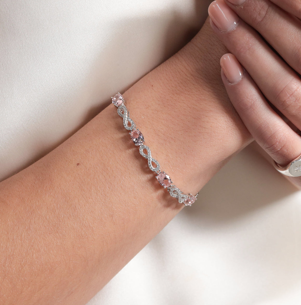 Silver bracelet with pink outlet stones